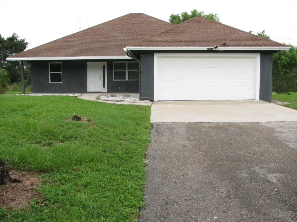Great 3 bedroom, 2 bathroom split floor plan home with 2 car garage on end, corner, double canal lot. Property is fenced and gated. Fresh paint inside. No pond. Close proximity to schools and Southern and Okeechobee Blvds.Please note: Ready for occupancy mid to late September.