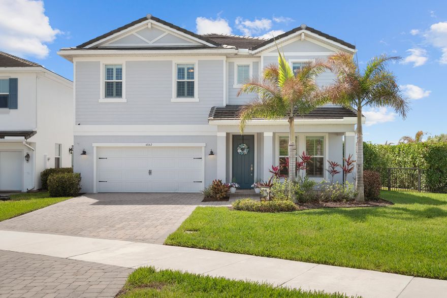 Be the second owners of this beautifully maintained home located in the gated community of Banyan Bay in Stuart. Situated on an oversized corner lot, this stunning Barkley model built in 2022 by Ryan Homes offers 4 bedrooms, 2.5 bathrooms, two office spaces, and nearly 3,000 square feet of thoughtfully designed living space - perfect for families who need both space and functionality. Immaculately kept and thoughtfully upgraded, the home features generous living areas, abundant storage, and an open-concept floor plan ideal for both everyday living and entertaining. The spacious kitchen is a true centerpiece, complete with an oversized island, farmhouse sink, double ovens, and a large pantry.  The first floor also includes a mudroom, formal dining room, storage closet, half bathroom, and two dedicated office spaces, offering flexibility for work-from-home living. Upstairs, the primary suite provides a peaceful retreat with an oversized bedroom, two beautifully designed custom closets, and a large walk-in shower. The second floor also features three spacious guest bedrooms, a full guest bathroom, and a conveniently located laundry room. Step outside to your private backyard oasis, complete with a newly installed saltwater pool that can be both heated and cooled, turf landscaping, and a screened pool enclosure - perfect for relaxing, entertaining, and enjoying Florida's year-round outdoor lifestyle. This exceptional home combines modern construction, thoughtful upgrades, and a prime corner-lot location - one you won't want to miss!  Situated on 250 acres of natural preserves, Banyan Bay is one of Stuart's newer gated communities and offers residents resort-style amenities including a clubhouse, heated community pool,  fitness center and kayaking dock. Conveniently located near shopping, dining, and major roadways, this move-in ready home offers the perfect combination of modern construction, upgrades, and Florida lifestyle living.