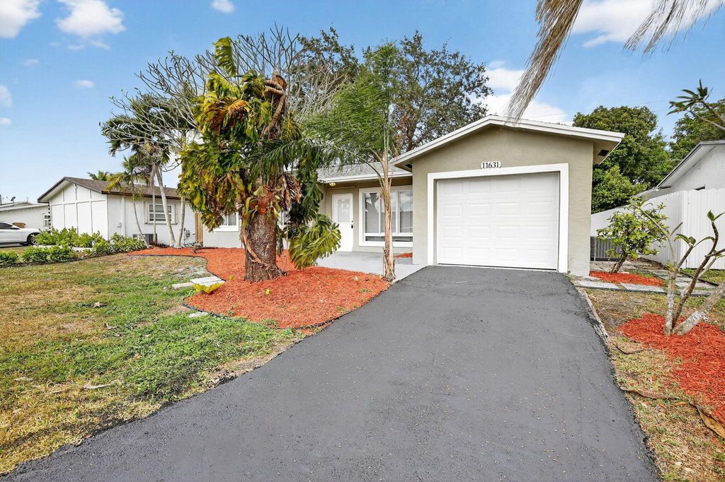 Photo of 11631 NW 32nd Manor, Sunrise, FL 33323 (MLS # R11145111)