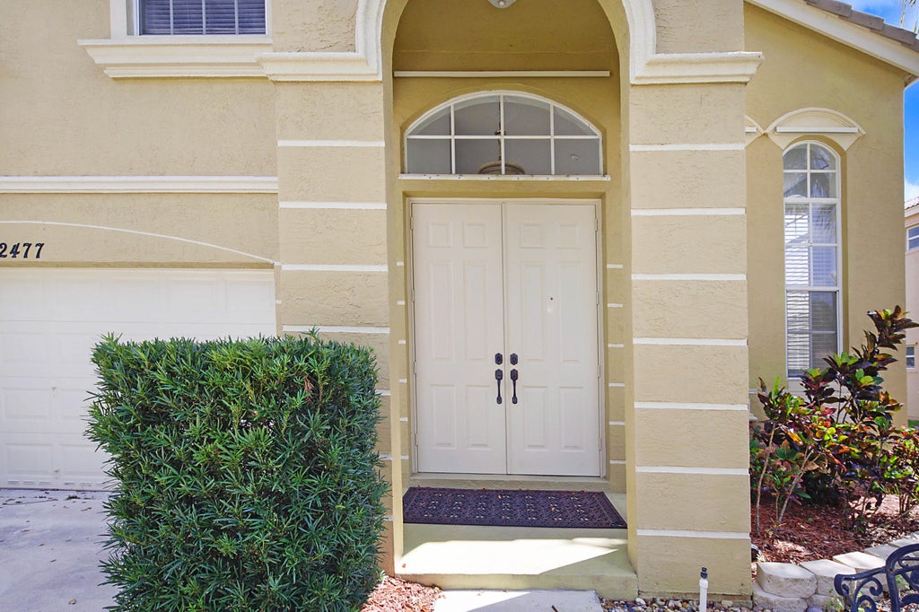 Photo of 2477 Westmont Lane, Royal Palm Beach, FL 33411 (MLS # R10976388)
