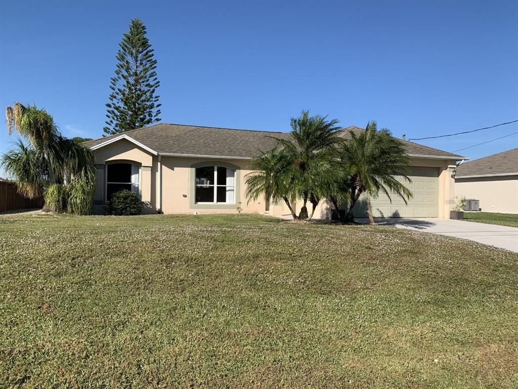 Photo of 371 SW Feldman Avenue, Port Saint Lucie, FL 34953 (MLS # R10763715)