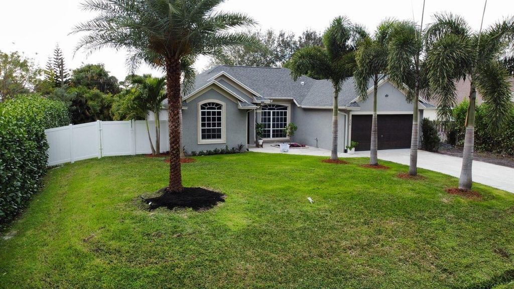 Photo of 958 SE Proctor Lane, Port Saint Lucie, FL 34983 (MLS # R10957053)