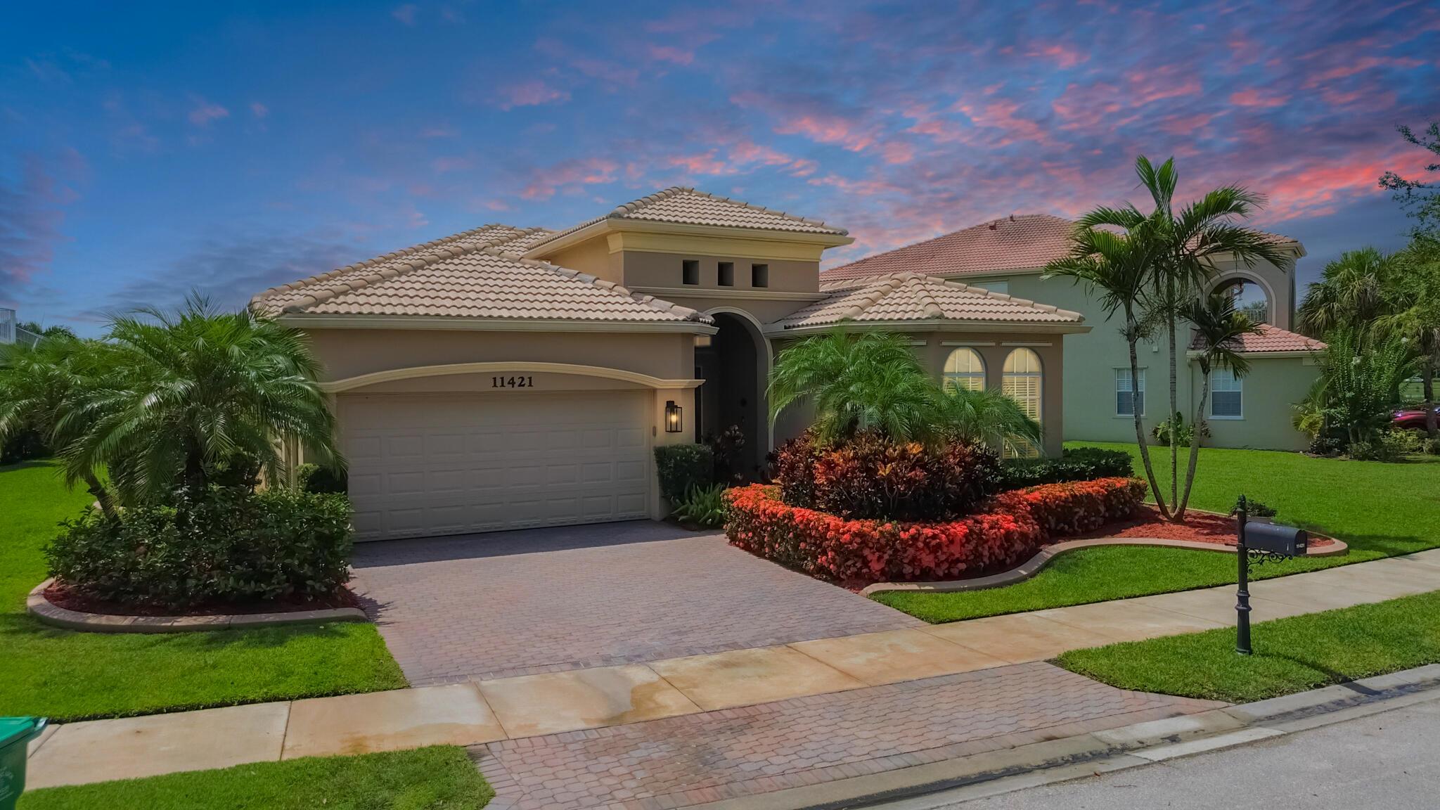TOWN PARK, STOCKTON! Lakefront masterpiece--this 3/2.5/2 pool home offers sweeping water views both front and back. Grand double-door entry leads to a soaring tray-ceiling foyer with exquisite crown molding, chair rail, and plantation shutters accents. Rich wood-look tile and elegant ceramic floors enhance the sophisticated design. Multiple living areas flow seamlessly into a designer kitchen with granite counters, 42'' wood cabinetry, stainless appliances, and walk-in pantry. Entertain effortlessly in the covered lanai, overlooking a dazzling lakefront pool and fenced yard. A rare blend of luxury, comfort, and serenity. community pool, play areas, game rooms, more! convenient to all Tradition has to offer.