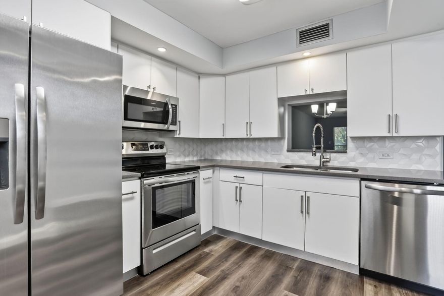 Discover this beautifully renovated 2-bed, 2-bath condo in the vibrant 55+ Wynmoor community! Featuring white cabinetry, vinyl floors, quartz countertops, new stainless steel appliances, new lighting, and spacious walk-in closets, this move-in-ready gem offers a serene garden view just steps from the pool. Enjoy resort-style living in a gated community with an 18-hole golf course, fitness center, tennis courts, and a bustling clubhouse hosting social clubs, yoga, art classes, and live entertainment. Relax at the theater, stroll scenic paths, or use the shuttle service. With 24/7 security and proximity to shopping, dining, and beaches, Wynmoor blends comfort and an active lifestyle. Schedule a tour today!