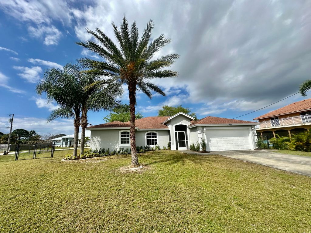 Photo of 5790 NW Dublin Drive, Port Saint Lucie, FL 34986 (MLS # R10960790)