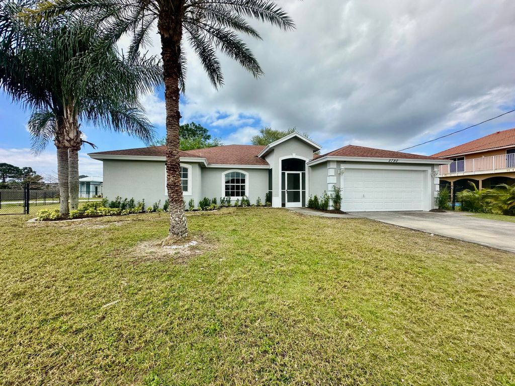 Photo of 5790 NW Dublin Drive, Port Saint Lucie, FL 34986 (MLS # R10960790)