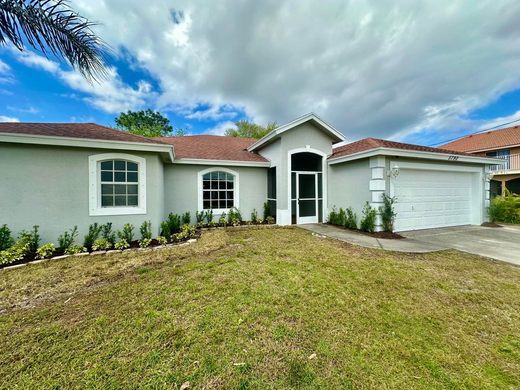 Photo of 5790 NW Dublin Drive, Port Saint Lucie, FL 34986 (MLS # R10960790)