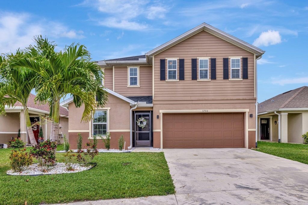 Photo of 5700 NW Pine Trail Circle, Port Saint Lucie, FL 34983 (MLS # R11088921)