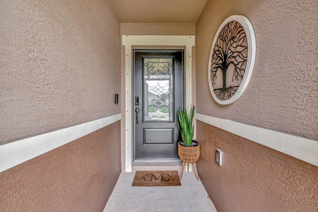 Photo of 5700 NW Pine Trail Circle, Port Saint Lucie, FL 34983 (MLS # R11088921)