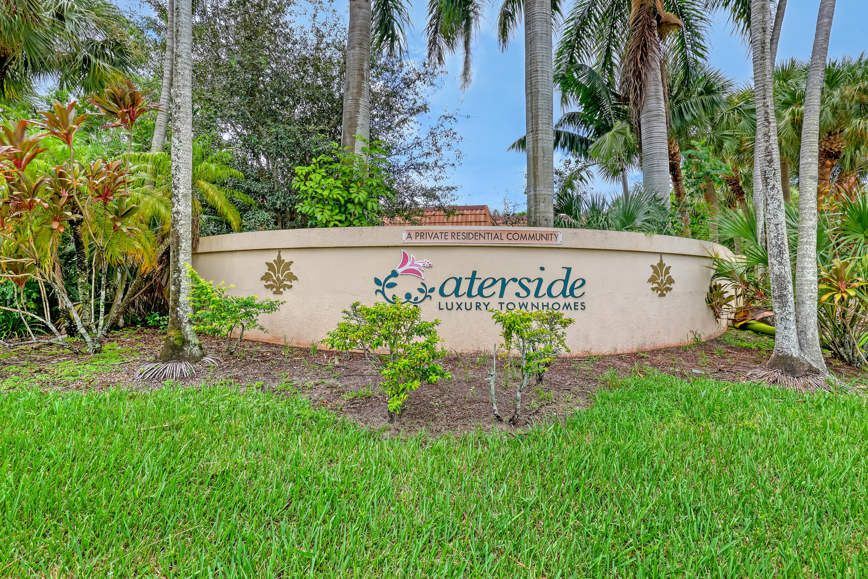 Discover a charming corner Townhome that perfectly combines comfort and convenience, located in the desirable Waterside Luxury Townhomes community, this 1,288 sq ft under living space has an inviting open layout filled with natural light. This residence features a gated front patio, 2 bedrooms, and 2.5 bathrooms, including a completely updated kitchen with stainless steel appliances. The main floor features an updated half bath, along with a washer and dryer for ultimate convenience. Modern porcelain tiles flow throughout the home, enhancing its appeal. Each bedroom includes an ensuite bath and private balcony. You'll enjoy 2 assigned parking spaces and a prime location near shopping, dining, I-95, and schools.