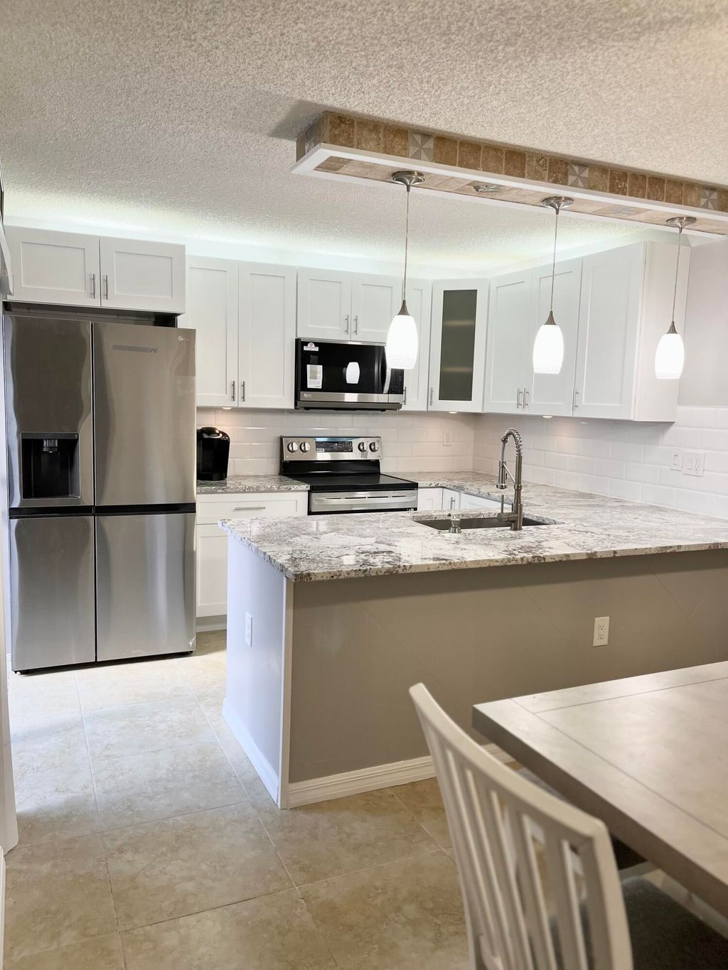 Photo of 405 Buttonwood Lane, Boynton Beach, FL 33436 (MLS # R10866882)