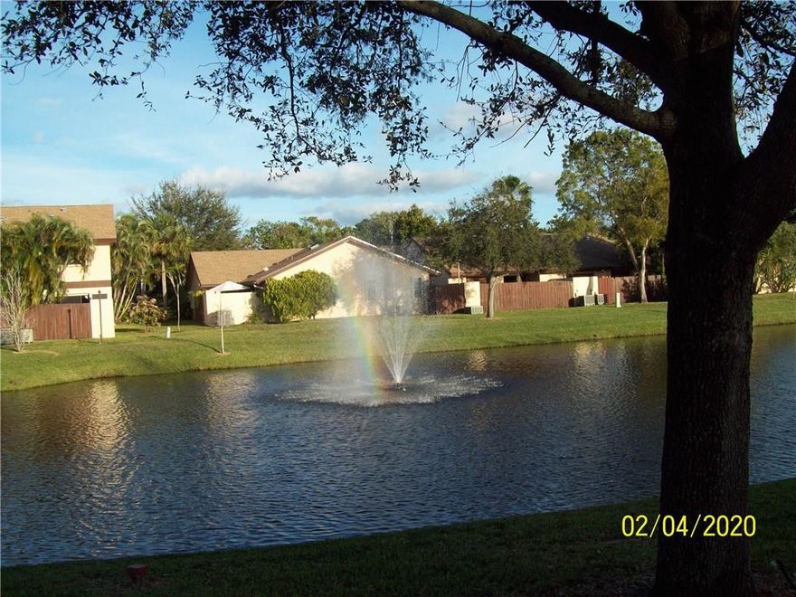 Rarely available 2 story, 3 bedroom 2 bath town home with private entrance.  One bedroom is downstairs. Two full bathrooms are nicely remodeled. The living area features soaring vaulted ceilings, an open kitchen and a large storage area under the modern tread stairs.  Outside is a sprawling private patio with room for child play area and separate storage closet. New stainless steel appliances in October 2019. Newer roof in 2017, accordion hurricane shutters, full-size washer, and dryer with pedestals. Assigned and guest parking.  Meticulously maintained gated community with management on site. Spa like clubhouse with full kitchen, fitness center and pool. Low HOA fees that include premium cable channels, 150MB wi-fi, pool, gym, landscaping, tennis courts. Pets allowed under 35 pounds Front Gate Code to get into complex is 476.  Lock box is on the left side of door by the Comcast cable.