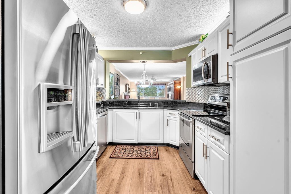 Photo of 9587 Weldon Circle #B311, Tamarac, FL 33321 (MLS # F10555419)