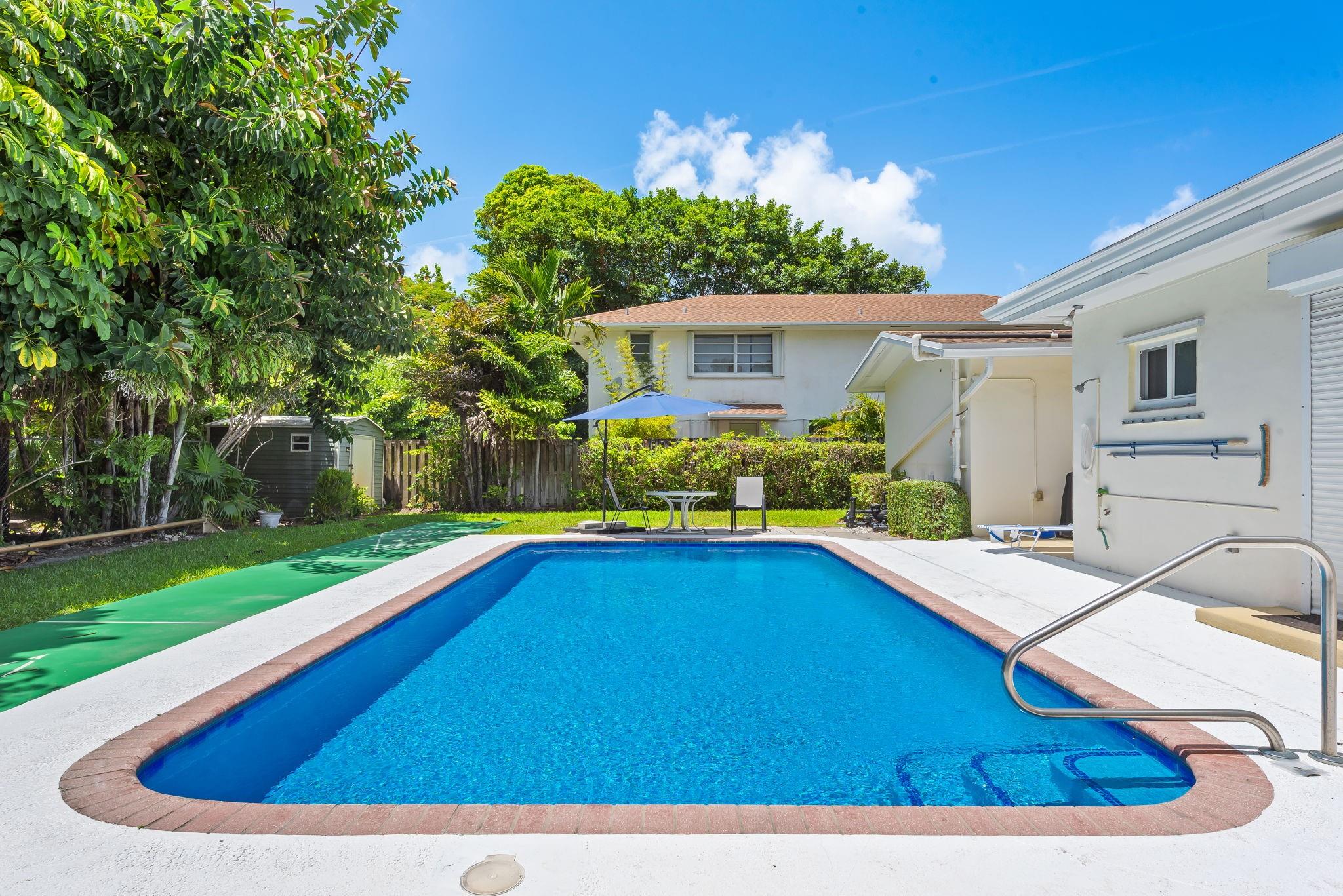 Highly desirable duplex, close to downtown and beaches in Lake Ridge area. 2 bedroom 2 bath with carport, lots of parking, private pool and fenced yard! Brand new bathrooms, floors, and full size washer/dryer in unit laundry room with utility sink and storage. Enjoy the beautiful pool in your peaceful backyard with shuffleboard. Yes, people still play shuffleboard. Eat in kitchen with view of pool, courtyard patio for outdoor dining, and living room with additional storage closet. Lawn care, water and trash included. No HOA, Pets not allowed.