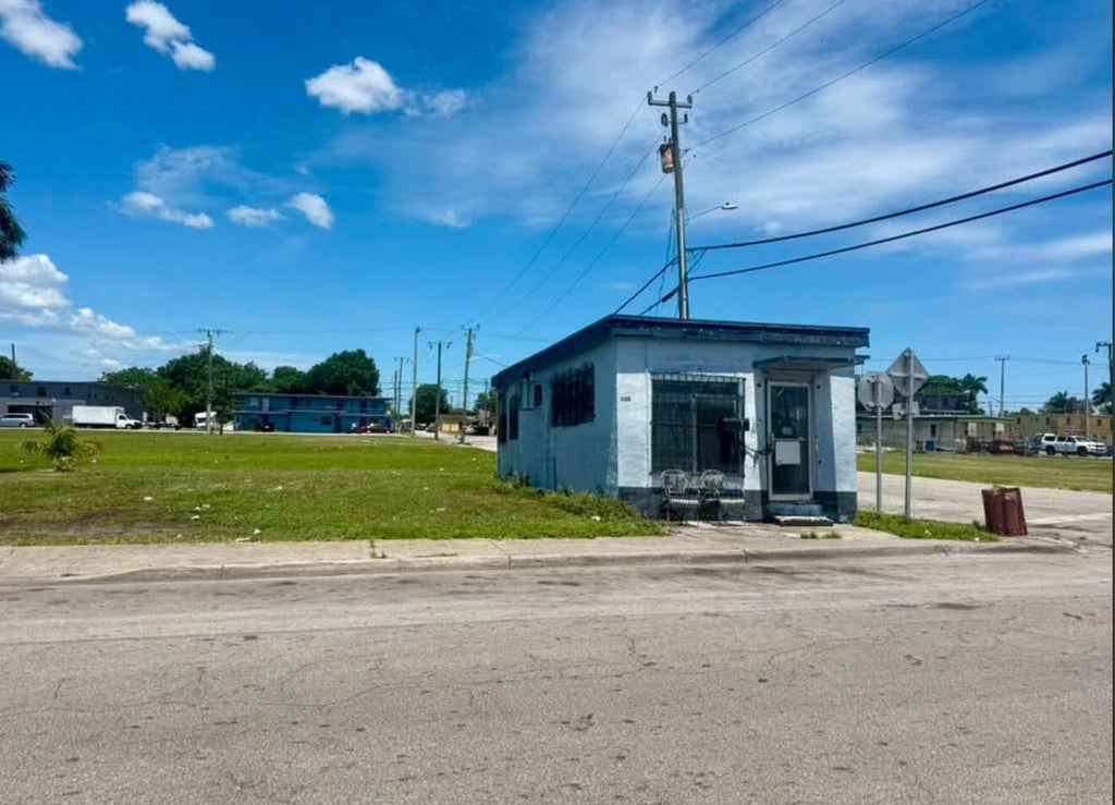 Photo of 300 SW 5TH Street, Belle Glade, FL 33430 (MLS # B26070668)