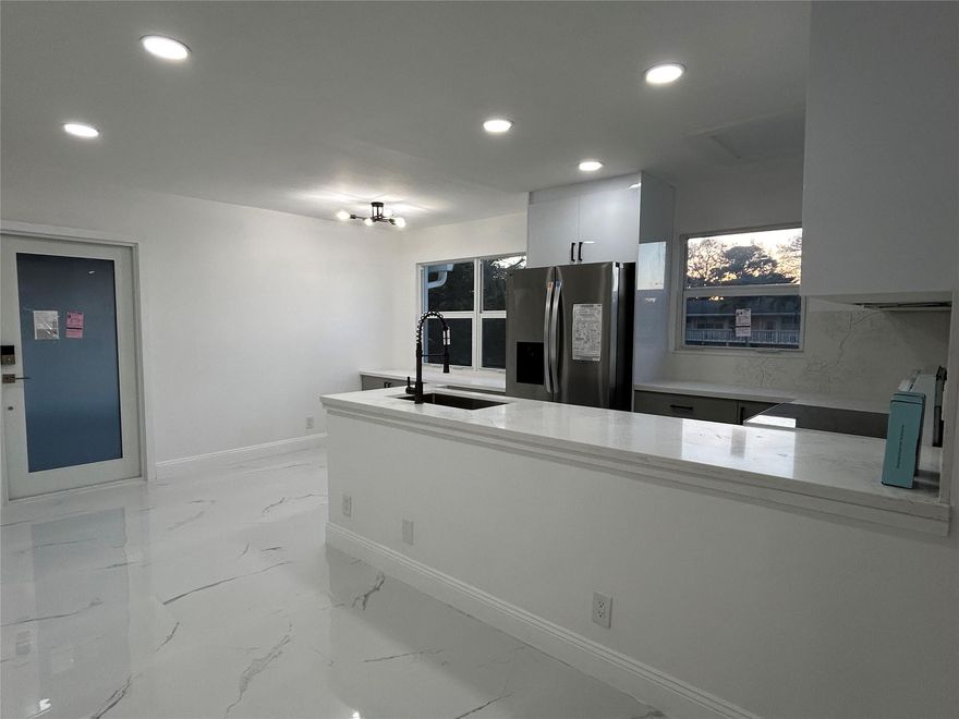 Absolutely immaculate with updates to every inch - brand new kitchen, bathrooms, High end impact windows and doors.  Brand new floors.  Kitchen with custom cabinets, brand new appliances and fixtures.  Bathrooms completely redone with beautiful touches like LED mirrors.  Screened balcony.  Adult Active community 55+ with many great amenities - pool indoor and outdoor, pickleball courts, gym, and much more.