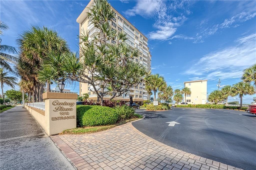 Immaculately maintained 2-bedroom, 2-bath condo w/ stunning Atlantic Ocean views, located in the desirable 55+ community of Century Plaza. This bright and spacious unit features an open-concept layout, upgraded kitchen, newer appliances, & all impact windows and doors. Your new home comes with a covered parking spot (#27) & a decent sized storage unit. Enjoy entertaining from the large kitchen that flows into the dining and living areas, leading to a balcony filled with natural light. The stacked bedroom floor plan offers privacy, & tile flooring runs throughout the unit. A washer & dryer are conveniently hidden behind kitchen cabinetry. Century Plaza offers secure building access, private beach entry, a heated pool, fitness center, & perfect for those seeking a vibrant coastal lifestyle.
