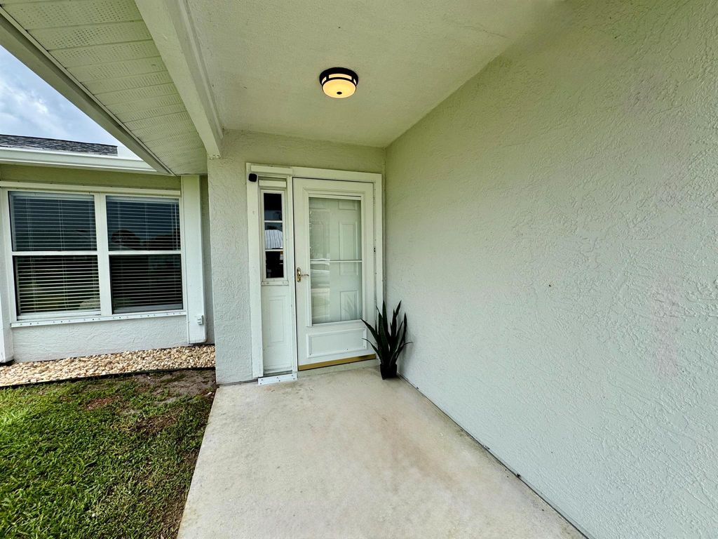 Photo of 347 SW Duxbury Avenue, Port Saint Lucie, FL 34983 (MLS # R11101033)