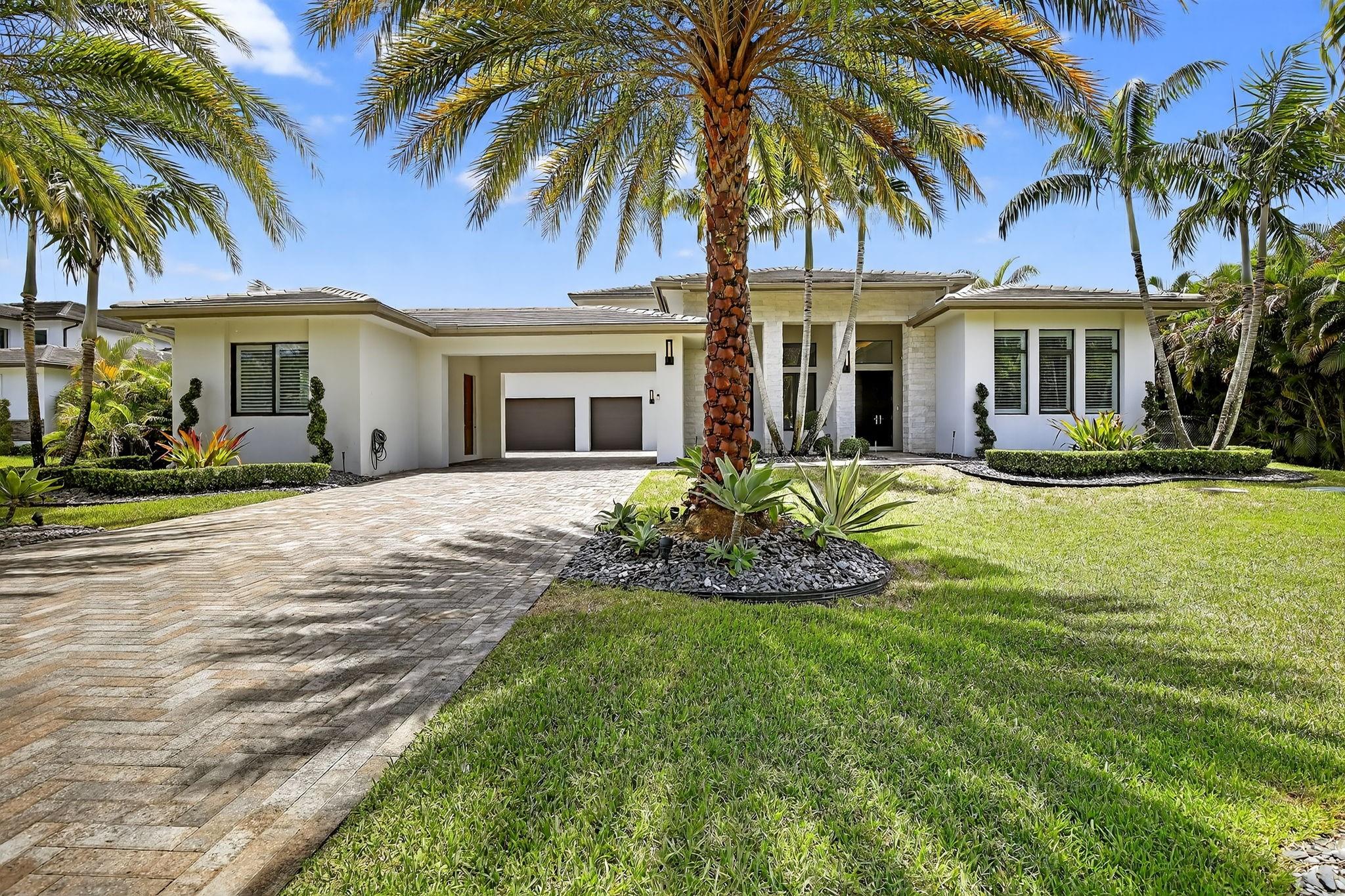 Welcome to this stunning residence in exclusive Plantation Acres. This impressive two-story home offers 6 bedrooms and 6.5 bathrooms, with two bedrooms on the main level—including a spacious master suite—plus a separate office. The home is an entertainer’s dream: step outside to a resort-style pool with a stunning outdoor kitchen and an 8-person hot tub, and enjoy a private casita (1 BR/1 BA) currently used as a gym. Inside, a gorgeous, luxurious kitchen provides exceptional space and finishes, and additional features include a 3-car garage and impact windows throughout. Don’t miss this rare opportunity in a premier neighborhood.
