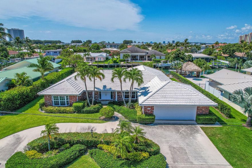 DO NOT miss this rare opportunity! Prime waterfront location on beautiful Singer Island offering 100 feet of water frontage on the best deep water canal on Singer Island as well as a lot depth of 131 feet, making it one of the largest lots in the area, and the highly sought-after southern exposure for your pool and back yard enjoyment. Located 9 homes in from the Intercoastal waterway this location provides easy access to Lake Worth Inlet and NO fixed bridges. A NEW vinyl sheathing seawall with cap is fully contracted with deposit in place and awaiting materials and is included in the sale price. The existing home was built in 1972 with 2809 square feet under air and a large 715 square foot finished rear porch and is ready for your