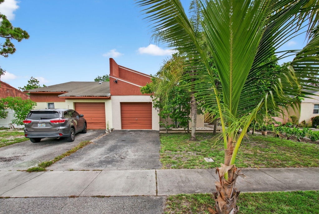 Photo of 589 NW 53 Avenue, Delray Beach, FL 33445 (MLS # R11104823)