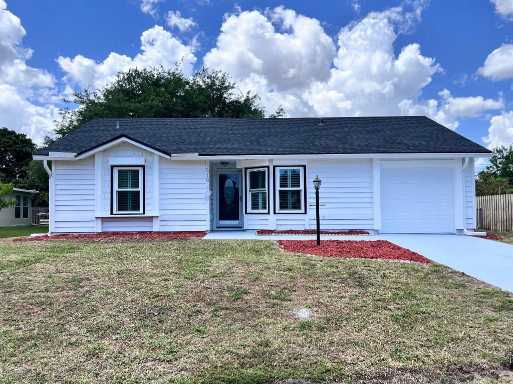 Photo of 2418 SE Sidonia Street, Port Saint Lucie, FL 34952 (MLS # R11077594)