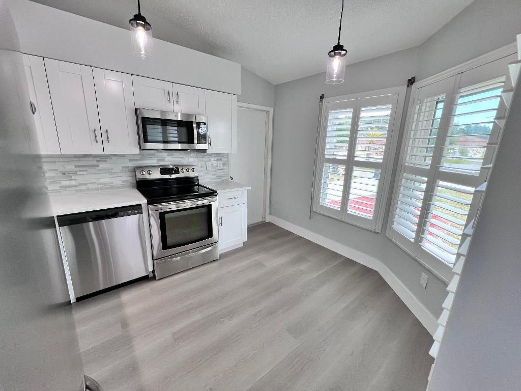 Photo of 2418 SE Sidonia Street, Port Saint Lucie, FL 34952 (MLS # R11077594)