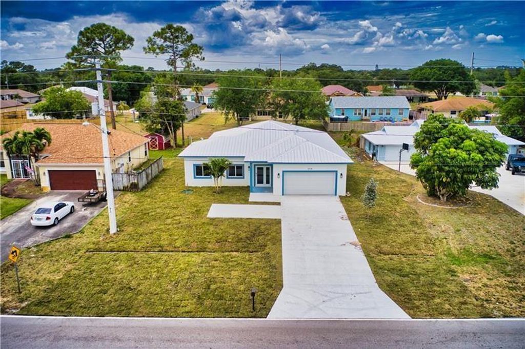 Photo of 2261 SE Manor Ave, Port Saint Lucie, FL 34952 (MLS # F10297018)