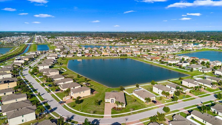 Welcome to the highly sought-after Brook model, one of only 12 homes of its kind in the gated Bent Creek community. Built in 2019, this thoughtfully designed 3-bedroom, 3-bath residence with a den offers both privacy and elegance, set on a generous .36-acre lakefront lot with tranquil water views.The home features a split floor plan, a side-load garage, and inviting outdoor spaces including a screened entryway and a screened, extended patio overlooking the lake--perfect for relaxing or entertaining. The kitchen is appointed with 42'' espresso cabinetry and GE Profile appliances, with a cohesive color palette carried throughout each bathroom. Notable upgrades include luxury vinyl flooring in the den and primary bedroom and a beautifully upgraded guest bath with a walk-in tiled shower.