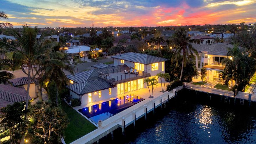 Welcome to this stunning, fully renovated waterfront home in the Lake Rogers neighborhood of Boca Raton. Boasting over 115' of dock space, this property is perfect for boating enthusiasts!
Step inside to discover a meticulously designed interior featuring a custom kitchen with high-end finishes, bespoke cabinetry, and an open-concept layout that seamlessly blends style and functionality. Sunlight pours into every room, highlighting breathtaking water views from every angle. 
Outdoors, indulge in your private oasis with a custom-designed pool just steps from the Intracoastal. Perfect for entertaining or relaxing, the spacious patio offers a seamless indoor-outdoor flow.  
Offering a short 5 minute walk to the beach, this home is a masterpiece of design and location!