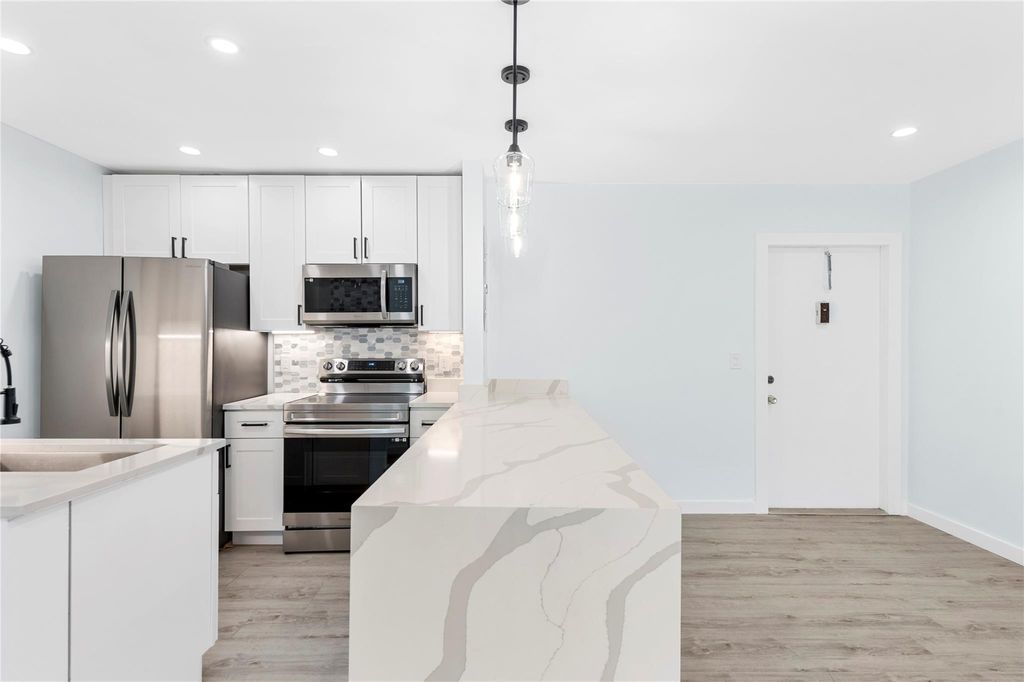 Photo of 825 NW 13th Street #101, Boca Raton, FL 33486 (MLS # F10508493)