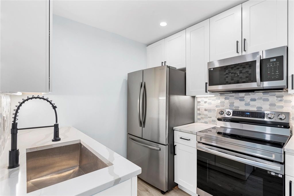 Photo of 825 NW 13th Street #101, Boca Raton, FL 33486 (MLS # F10508493)