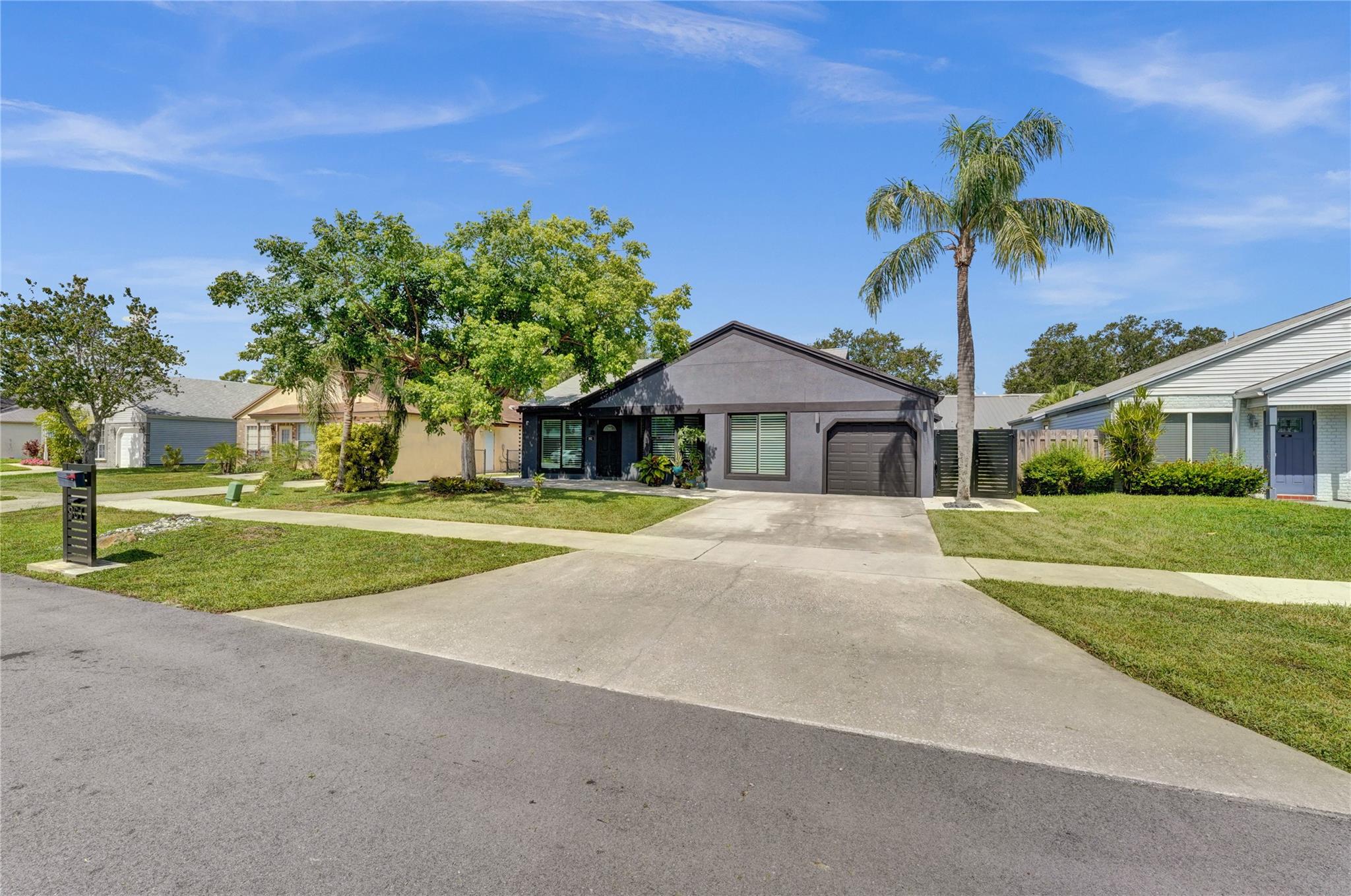 Enjoy peace of mind and style in this beautifully upgraded home featuring a fresh stucco exterior, impact windows and garage door, a large front patio, and a fenced yard with serene lake views. The kitchen includes modern appliances and a stylish backsplash. A bonus room off the kitchen offers flexible space for a home office, dining area, or playroom, while another bonus room behind the primary bedroom is ideal for a private retreat, nursery, or oversized closet. The home is EV charger ready. Additional highlights include energy-efficient lighting, ample storage throughout, and easy access to nearby parks, shopping, top-rated schools, and all major highways—making it a perfect place to call home. Seller is also providing a warranty through American Home Shield, adding extra peace of mind.