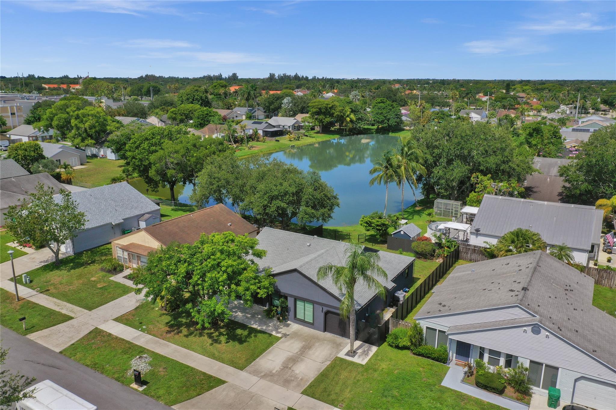 Enjoy peace of mind & style in this beautifully upgraded home featuring a fresh stucco exterior, impact windows and garage door, a large front patio, and a fenced yard with serene lake views. The kitchen includes modern appliances & a stylish backsplash. A bonus room or 4th bedrm off the kitchen offer flexible space for a home office, dining area, or playroom. The room behind the primary bedroom is ideal for a private retreat, nursery, or oversized closet. The home is EV charger ready. Additional highlights include energy-efficient lighting, ample storage throughout, & easy access to nearby parks, top-rated schools, & all major HWY'S making it a perfect place to call home. Seller is also providing a warranty through American Home Shield adding extra peace of mind. THIS HOME IS A MUST SEE