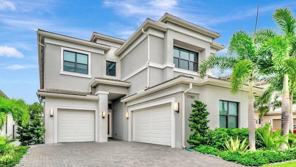 Priced to sell. Don't miss this opportunity! This like-new, custom-designed home in Boca Bridges is the best-priced in the community. Featuring 5 bedrooms, 5 full baths, & 2 half baths, this residence offers breathtaking sunsets over a serene lake from your private backyard retreat. Enjoy the luxurious saltwater pool, marble pavers & turf with friends & family. The home is equipped with impact-resistant windows, providing enhanced protection & energy efficiency. Additional features include a 3-car garage, with the single-car bay transformed into an air-conditioned kids' game room, & a chef's dream kitchen boasting upgraded KitchenAid & Sub-Zero appliances, a gas stove, & elevated GE washer & dryer pedestals. This home is richly appointed with hardwood & large-format tile flooring, custom