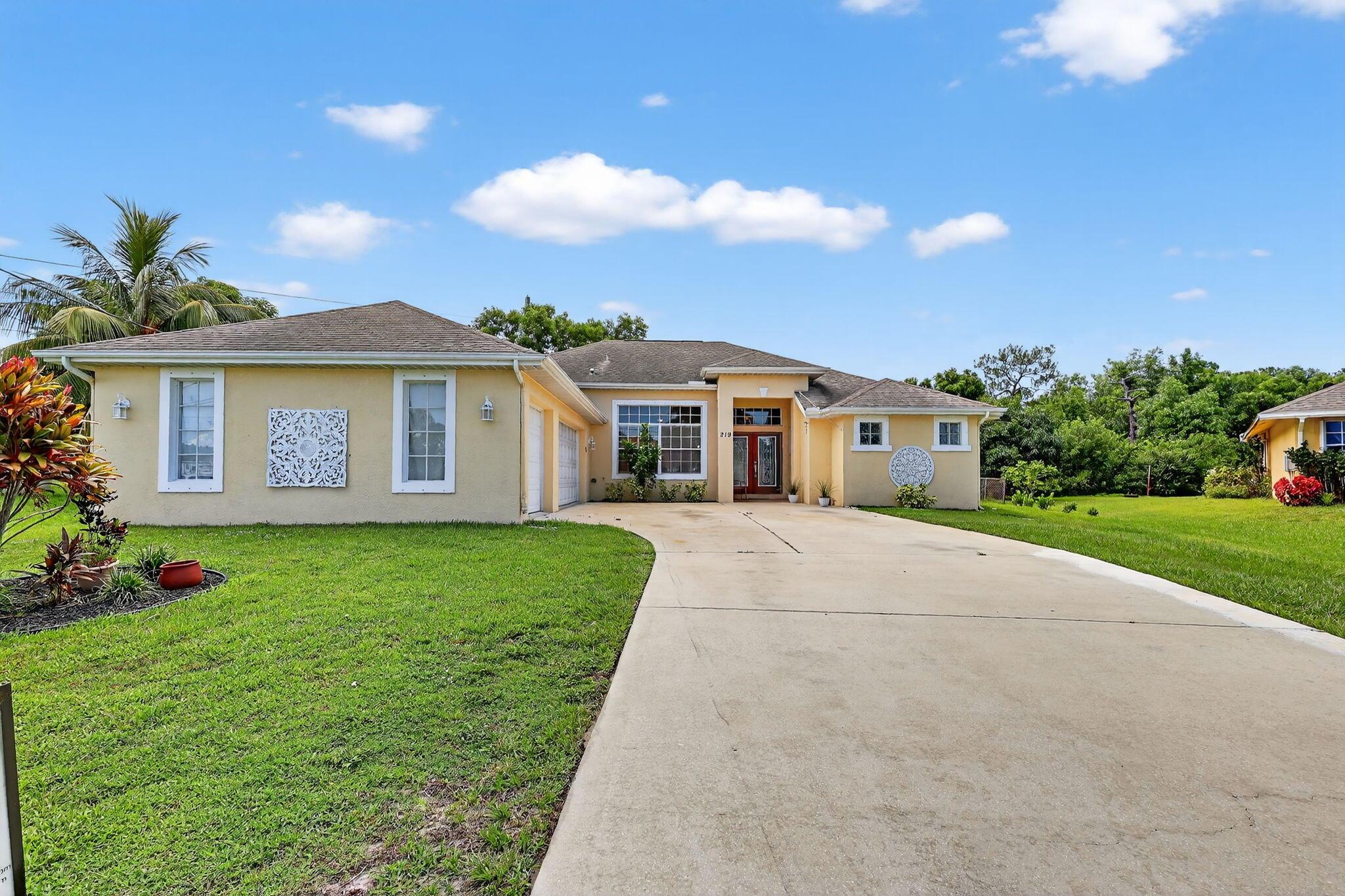 Two Master Suites in your Port St Lucie home! This impressive 5 BEDROOM 4 BATH home on a prime corner lot offers a unique and desirable feature: the TWO MASTER SUITES are ideal for Multi-generational living or a comfortable mother-in-law suite. One of the master suites includes a practical stackable washer/dryer. Tucked away for tranquility, yet with easy access to I-95 and the Turnpike, this home offers the best of both worlds. You'll appreciate the flexible split floor plan with a large great room, dramatic vaulted ceilings, and spacious additional bedrooms. A 3-car garage offers ample storage. The ''Tale of Two Backyards'' offers a private fenced area perfect for a pool and a large additional space for your outdoor needs. Don't miss this exceptional home with incredible flexibility!