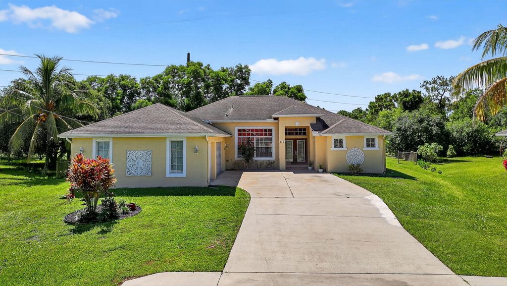 Photo of 219 SE Sims Circle, Port Saint Lucie, FL 34984 (MLS # R11066249)