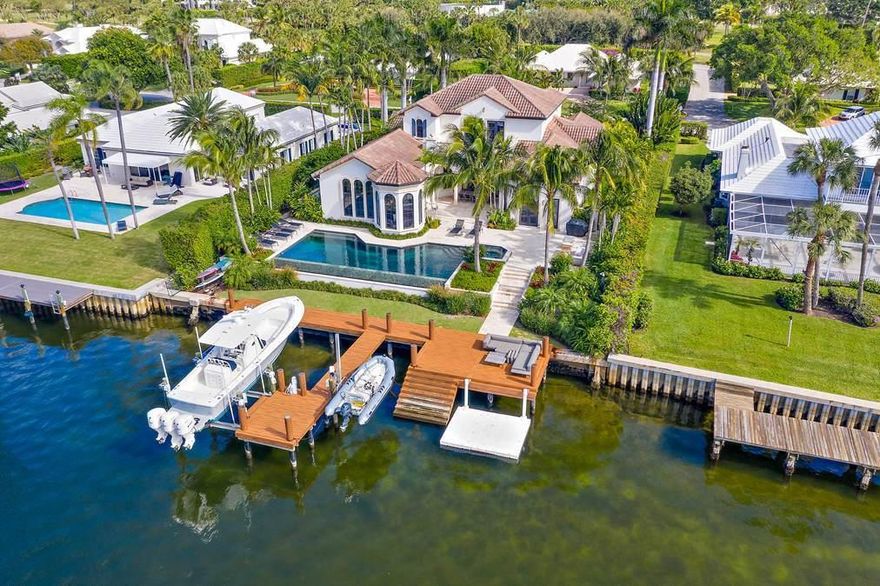 Sweeping Intracoastal views from almost every room! Situated on Little Lake Worth, this waterfront home offers 4 bedrooms, 5 bathrooms, an office, and approximately 92 feet of Intracoastal frontage. With an ideal location near the Golf Club and Fitness Center, this home offers the best of the Lost Tree lifestyle