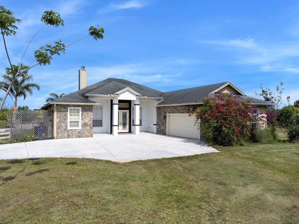 Photo of 7900 Germany Canal Road, Port Saint Lucie, FL 34987 (MLS # R11094193)