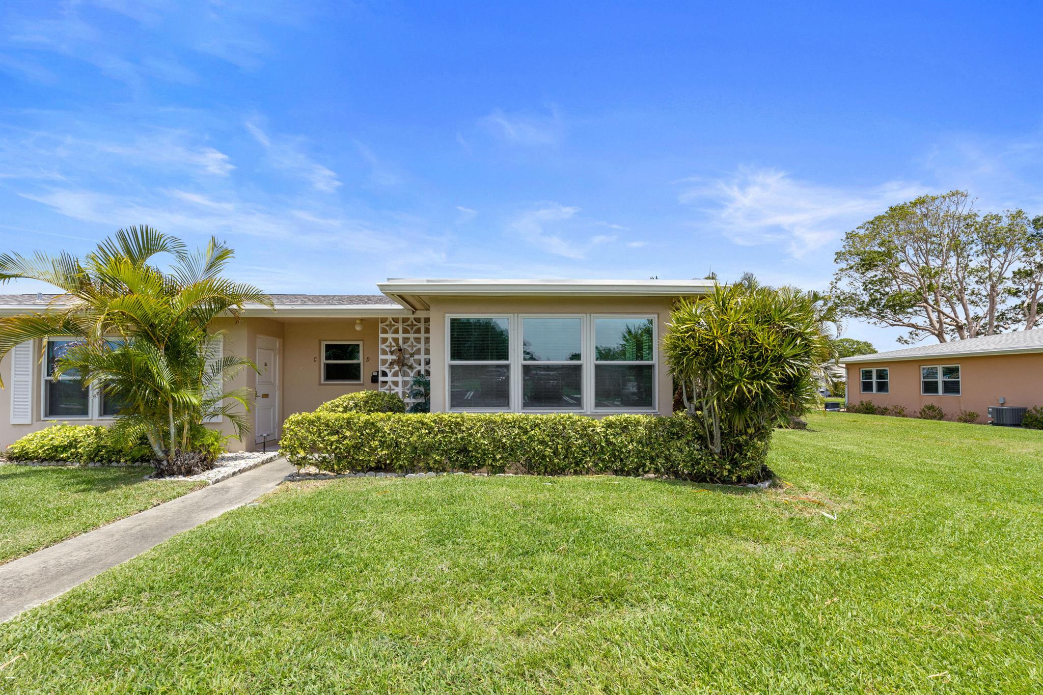 Bright & Open villa style condo in the highly desirable Section 4 of High Point! Hurricane impact windows, tile flooring throughout living areas. Open kitchen with barstool seating, SS appliances, granite countertops, hi-hat lighting, smooth ceilings and extended cabinetry perfect for extra storage or to use as a buffet. Florida Room with sliders removed, floor raised, smooth ceilings and vented for HVAC. Spacious & lush patio with fixed awning adds so much living/dining space. Primary bedroom with carpeting and ensuite with separate vanity area & step in shower. HWH 2020. Roof 2022. Unit is being sold furnished with exclusions.