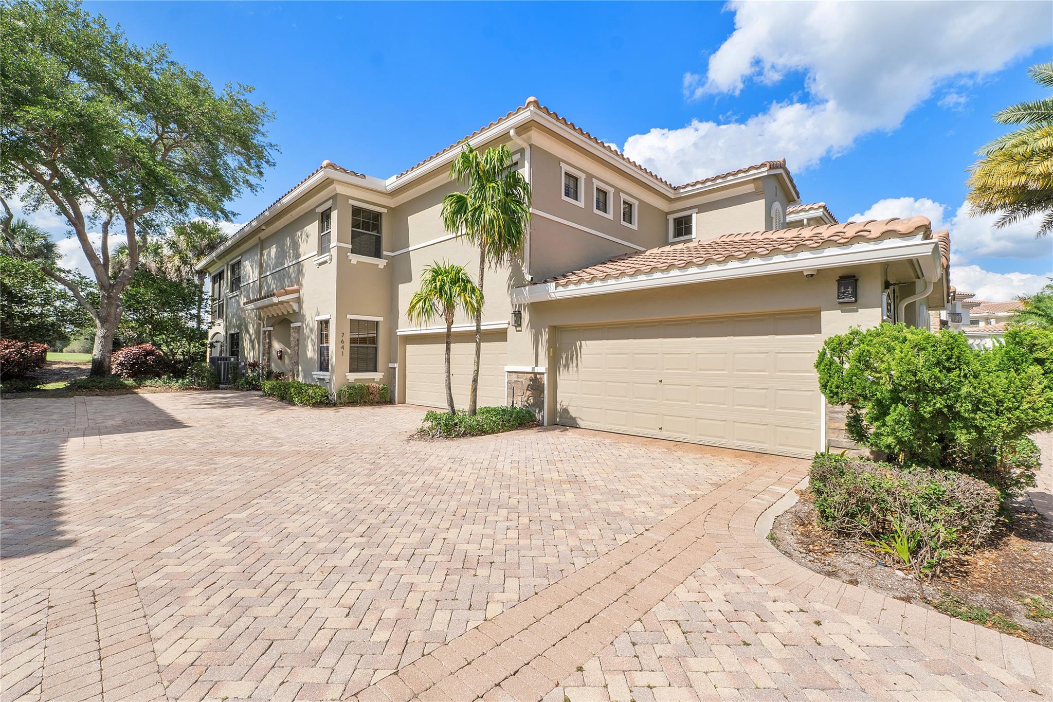 Lowest priced 3-bedrooms, 2-baths first floor coach home w/two car garage corner residence in Caseres/Parkland Golf & Country Club. This home offers a range of amenities, such as a new roof, exterior insurance, lawn maintenance, roof repair, exterior painting provided by the homeowners' association. Residents have access to the community's fitness center, tennis, pickleball, bar & restaurant, golf course, sports club, & pool amenities. The residence features impact glass windows+ a large, screened patio with a serene+ picturesque setting. Beautiful onsite restaurant, pickleball, gym, tennis, an ideal living opportunity for those seeking a maintenance-free lifestyle. Available for Sale, Rent $5000 +or Lease purchase. Rent includes Sports Membership, Owner paid the roof assessment in full.