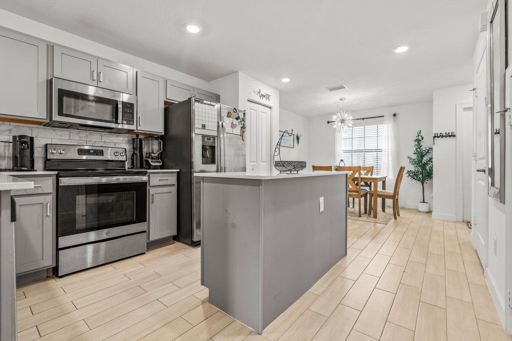 Photo of 5031 Genove Place, Riviera Beach, FL 33410 (MLS # B26069305)