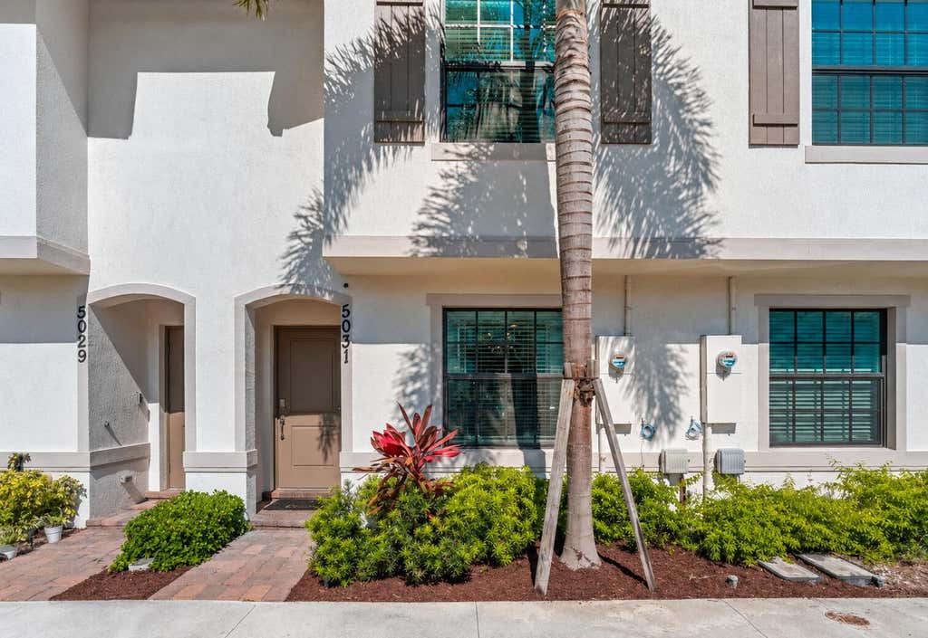 Photo of 5031 Genove Place, Riviera Beach, FL 33410 (MLS # B26069305)
