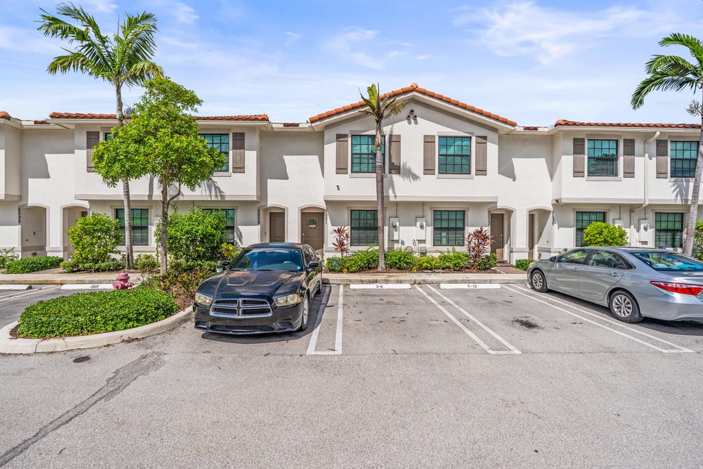 Photo of 5031 Genove Place, Riviera Beach, FL 33410 (MLS # B26069305)