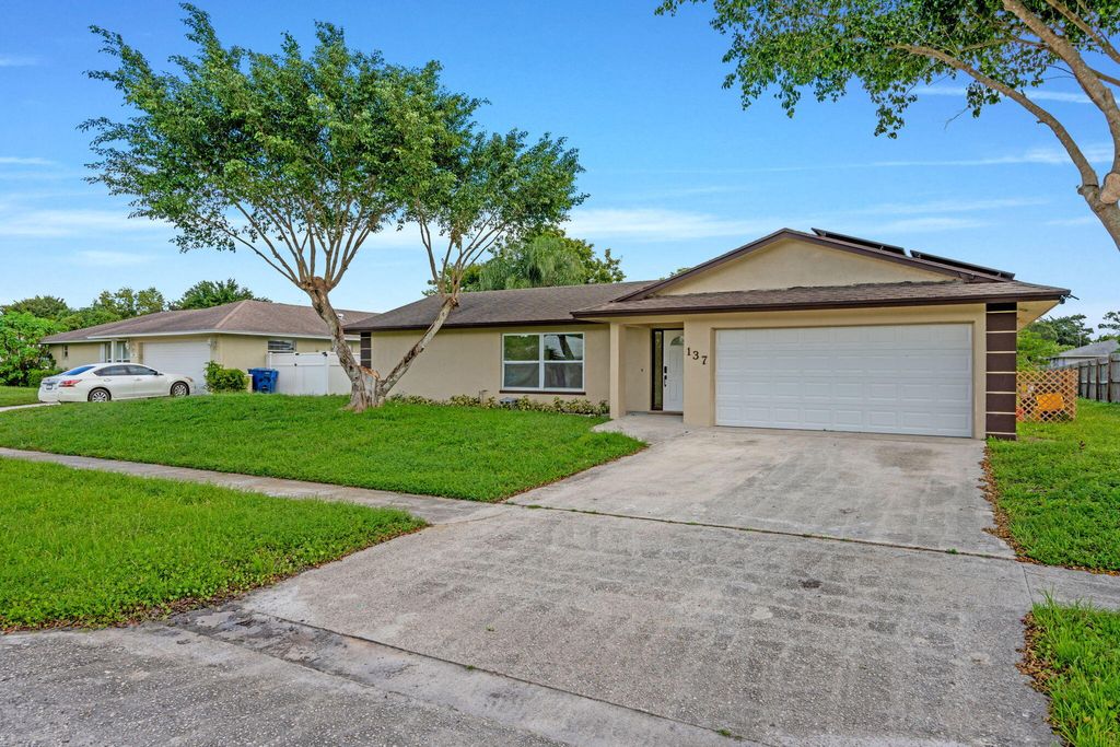 Photo of 137 Alcazar Street, Royal Palm Beach, FL 33411 (MLS # R11133984)
