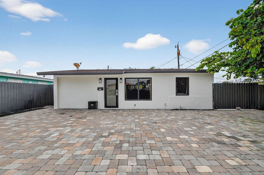 Welcome to your tropical getaway! This beautifully updated 3BR/2BA home in West Palm Beach offers modern comfort and coastal charm. Enjoy an open layout, wood-look tile floors, impact windows, and a sleek kitchen with updated baths. Relax in the private fenced yard or on the open patio. Ideally located minutes from beaches, downtown, Worth Avenue, Palm Beach Zoo, and top dining spots. Includes a paved driveway, tankless water heater, and no HOA. Perfect seasonal retreat—bright, stylish, and close to everything South Florida has to offer!