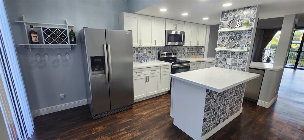 Investors welcome! Completly remodeled 2 bedrooms & 2 bathrooms unit. Open concept kitchen with gorgeous stone countertops and modern peninsula, Stainless Steel appliances. Laminated waterproof wood-effect flooring throughout, new light fixtures, washer and dryer located in the unit, huge walk-in closet in main master bedroom, large screened balcony with direct lake view, and conveniently located in the heart of Davie for quick access to highways, restaurants, shopping, Nova University, Miami dolphins training camp, airport and NEW Hospitals! A+ Elem & Middle schools! Community pool, club house, tennis and much more. This property is "Move-In-Ready" for the perfect family wanting to live in a calm and relaxing community or to an investor that wants a property that can be rented right away.
