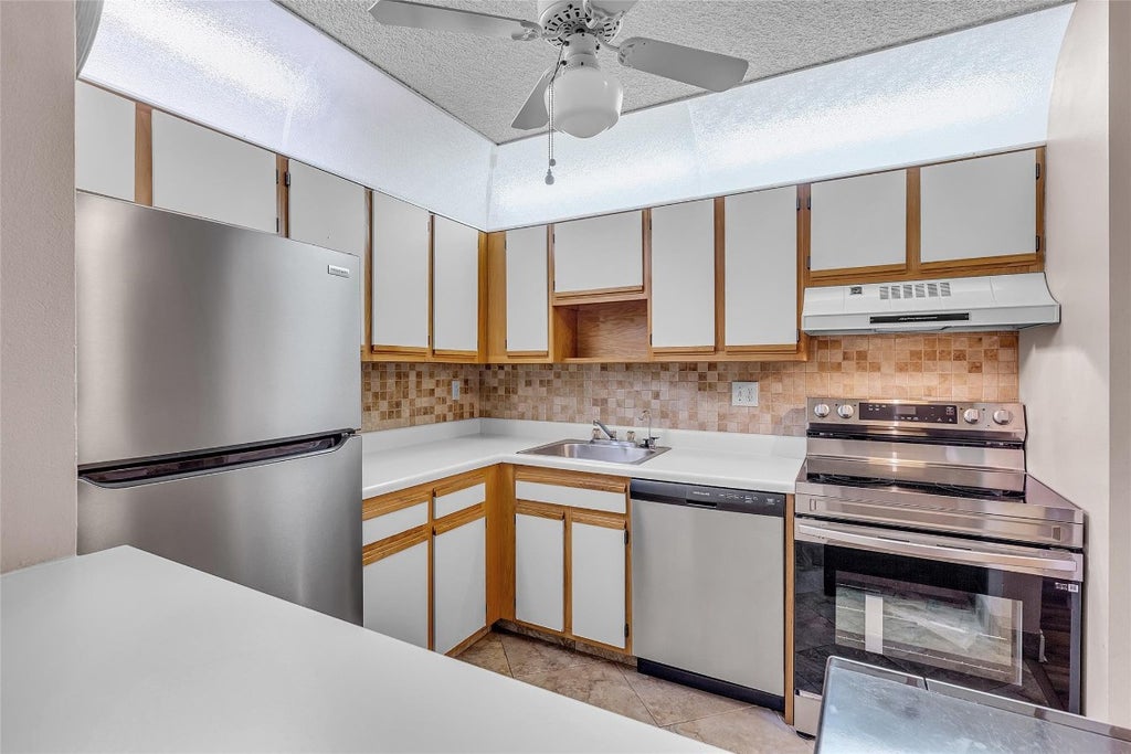 Photo of 10895 W Clairmont Circle #116, Tamarac, FL 33321 (MLS # F10487889)