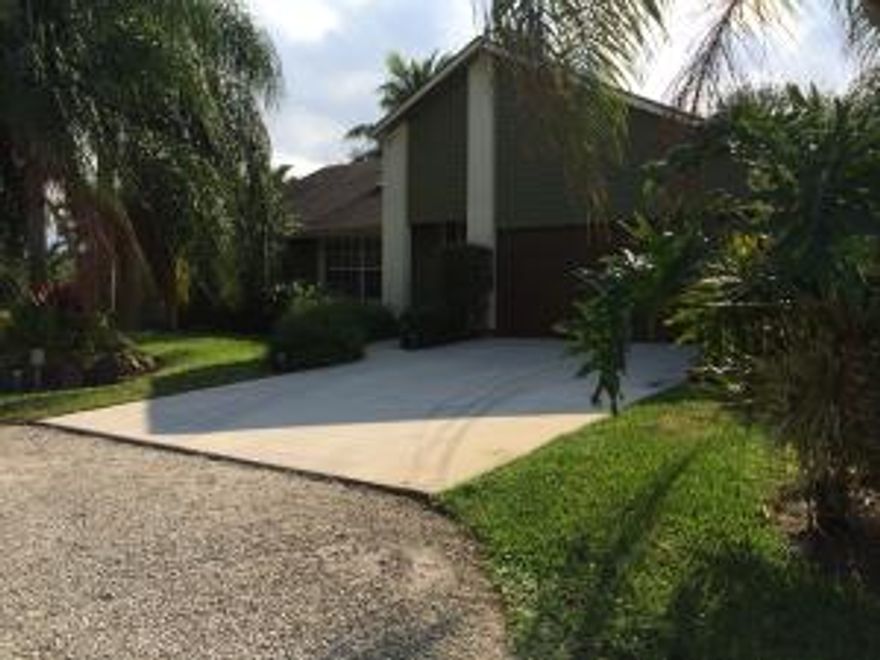 Like buying a new house. Absolutely perfect 3BR/2BA/2 car-garage/pool home on corner lot. High-impact window throughout. Completely remodeled inside-kitchen, baths, laundry, flooring. Immaculate lushly landscaped, fenced yard.Solar heated pool.Circle driveway.Pristine condition in every way. Hooked to city water.