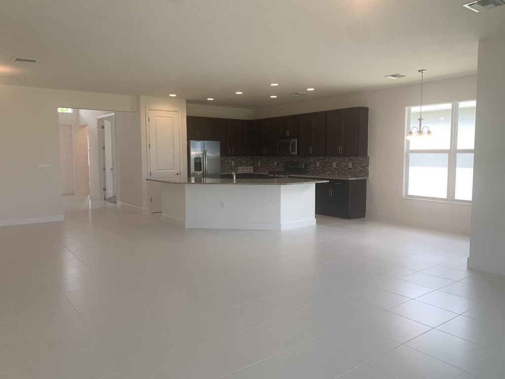 Photo of 11933 SW Poseidon Way, Port Saint Lucie, FL 34987 (MLS # B26066654)